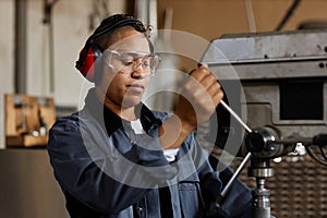 Portrait Of Female Worker At Industrial Factory