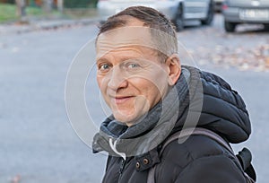 Portrait of a fifty-year-old man of European appearance in outerwear