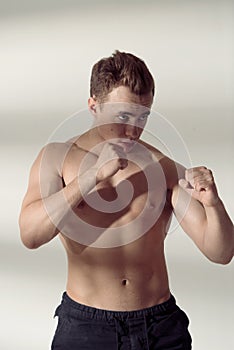 Portrait of fighter man in fighting stance