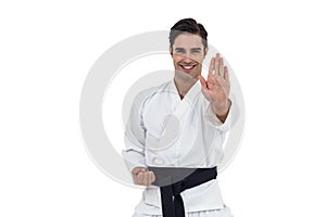 Portrait of fighter performing karate stance