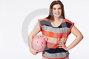 Portrait, finance and woman with piggy bank in studio for savings, payment our budget on white background. Money, box or photo