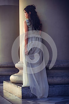 The fine young girl with a light dress. Romance style