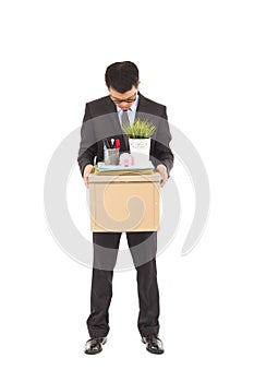 Portrait of a fired businessman carrying a box