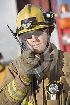 Portrait Of A Firefighter Talking On Radio