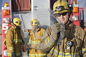 Portrait Of A Firefighter Talking On Radio photo