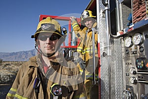 Portrait Of A Fireman With Coworker In The Background photo