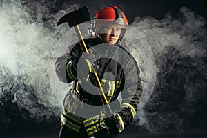 Portrait of fireman with hammer