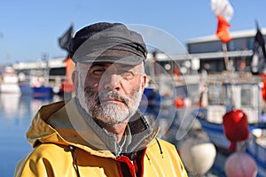 A portrait of a fisherman in the harbor