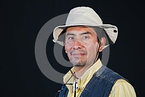 A portrait of a fisherman isolated against black background