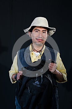 A portrait of a fisherman isolated against black background