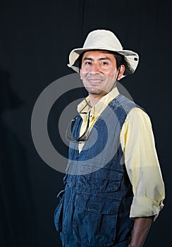 A portrait of a fisherman isolated against black background