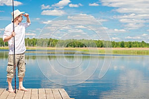 Portrait of a fisherman on a pier looking away