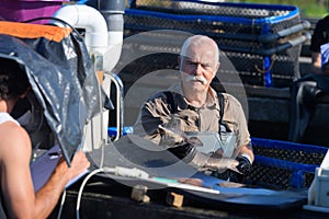 portrait fisherman preparing fishes