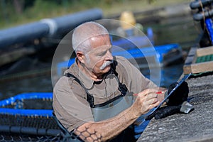 portrait fishfarm worker photo