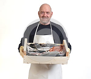 Portrait of a fishmonger with a box with seafood on white background