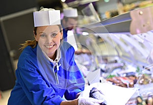 Portrait of fishmonger at work