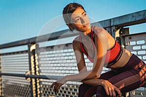 Portrait of fit sporty young woman in city. People sport exercise urban healthy lifestyle concept