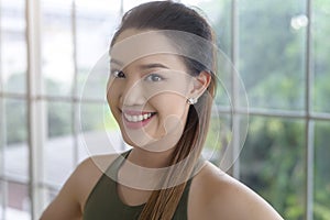 Portrait of fit young woman wearing sportswear at home, sport and healthy lifestyle concept