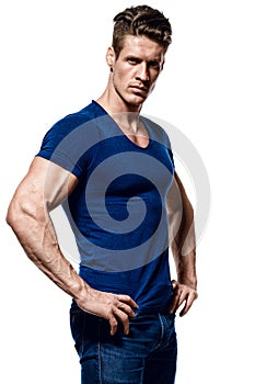 Portrait of a fitness man in blue shirt and jeans