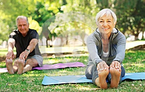 Portrait, fitness and senior couple in a park, yoga and meditation for wellness, workout and healthy lifestyle. Face