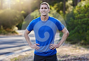 Portrait, fitness and smile of man in nature ready for running, exercise or workout. Sports, training face and happy