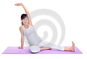 Portrait, fitness and yoga with pregnant woman on mat in studio isolated on white background for health. Exercise