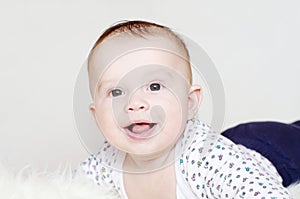 Portrait of the five-months laughing baby