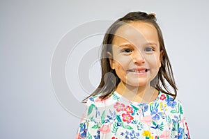 Portrait of a five year old girl making funny faces