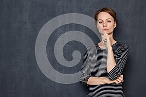 Portrait of focused serious girl attentively listening interlocutor