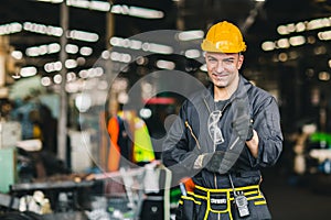 Portrait of foreman labor worker engineer working in industrial factory and waring safety suit happy smile hand show thumb up