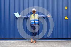 Portrait of foreman or worker working holding clipboard at Container cargo site checkup goods in container. import export shipping