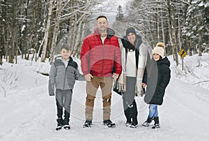 Portrait of a four Family On forest Winter season