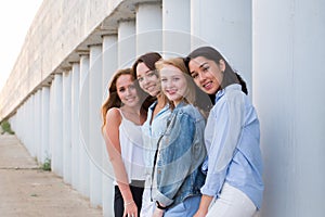 Portrait of four femle friends looking friendly at camera, smile, happy. people, lifestyle, friendship concept