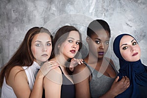 Portrait of four girls with different skin color and nationality.