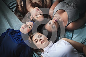 Portrait of four girls with different skin color and nationality.