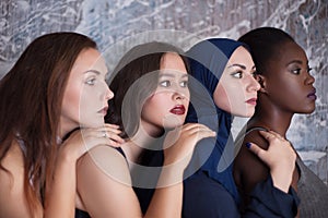 Portrait of four girls with different skin color and nationality