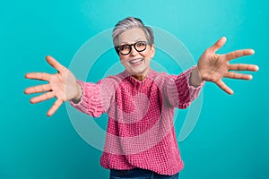 Portrait of friendly crazy person with gray hairstyle wear knit pullover stretching arms to hug you isolated on