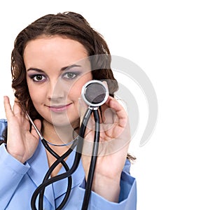 Portrait of a friendly female doctor with stethoscope isolated on white