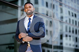 Portrait of a friendly, genuine, candid, warm business person smiling cheerful, happy and successful, in suit and tie