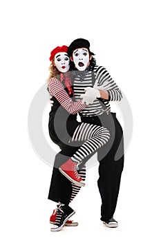 Portrait of frightened mimes