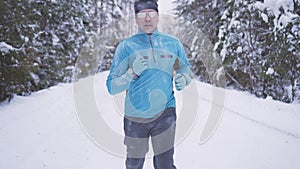 Portrait frozen sports athlete man, portrait of an athlete in winter, running in a cold time