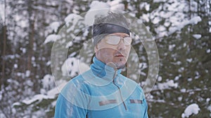 Portrait frozen sports athlete man, portrait of an athlete in winter, running in a cold time