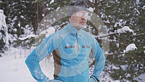 Portrait frozen sports athlete man, portrait of an athlete in winter, running in a cold time