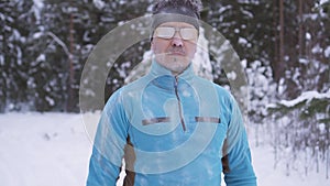 Portrait frozen sports athlete man, portrait of an athlete in winter, running in a cold time,winter sports