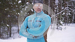 Portrait frozen sports athlete man, portrait of an athlete in winter, running in a cold time,winter sports