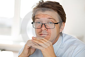 Portrait of frustrated business man wearing glasses