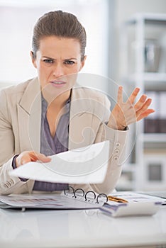 Portrait of frustrated business woman at work