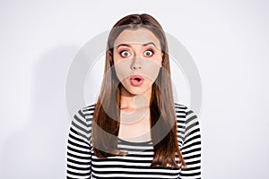 Portrait of frustrated lady looking at camera wearing striped pullover  over white background