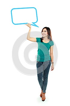 Portrait of full lenght young girl holding blank text bubble in