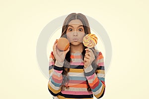 portrait of fun. funny teen girl with orange lollipop. vitamin and dieting. child dental care.